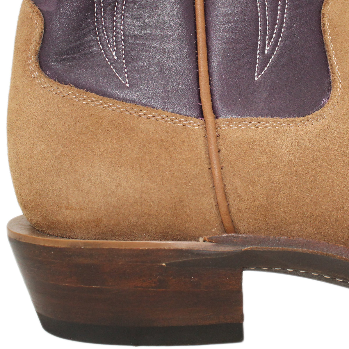 16" Purple Upper w/ Tulip Stitching

Saddle Timberjack Rough Out Steer Vamp

Regular French Square Toe

Slightly Tapered Heel